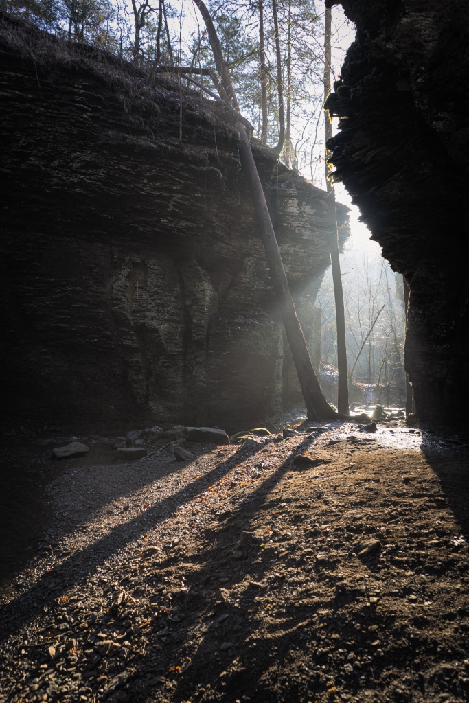 Morning light coming through fog in a grotto